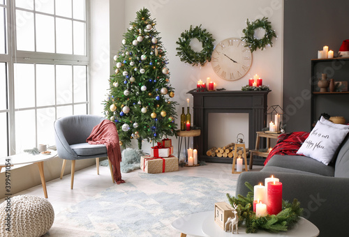Beautiful living room with fireplace decorated for Christmas