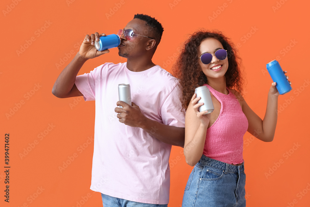 African-American couple with soda on color background African-American couple with soda on color background