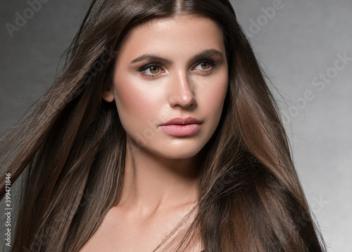 Beautiful woman face portrait with long hair brunette 