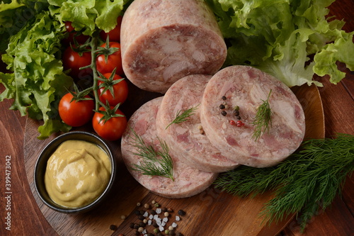 Homemade headcheese with dill and mustard, and cherry tomatoes photo