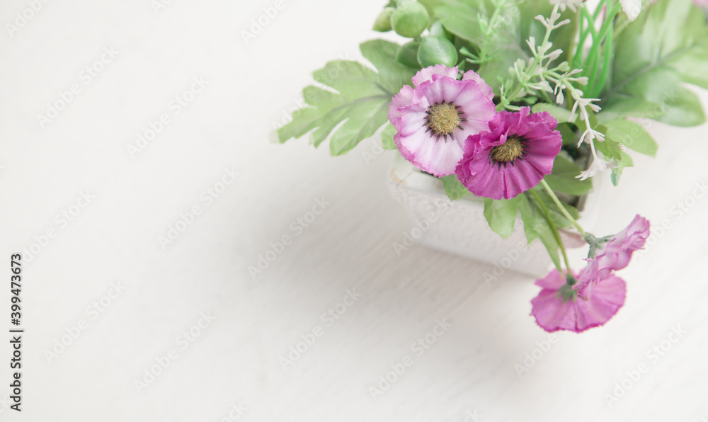 Flowers on the white desk. Space for your text Flowers on the white desk. Space for your text