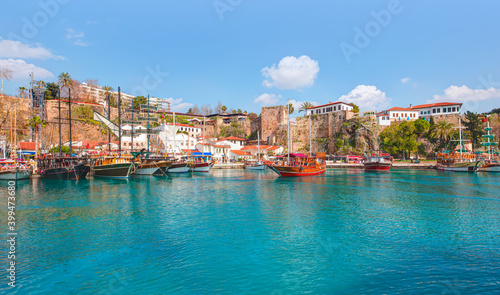 Tourists enjoying sea journey on sail yacht - Old town "Kaleici" -Antalya, Turkey 