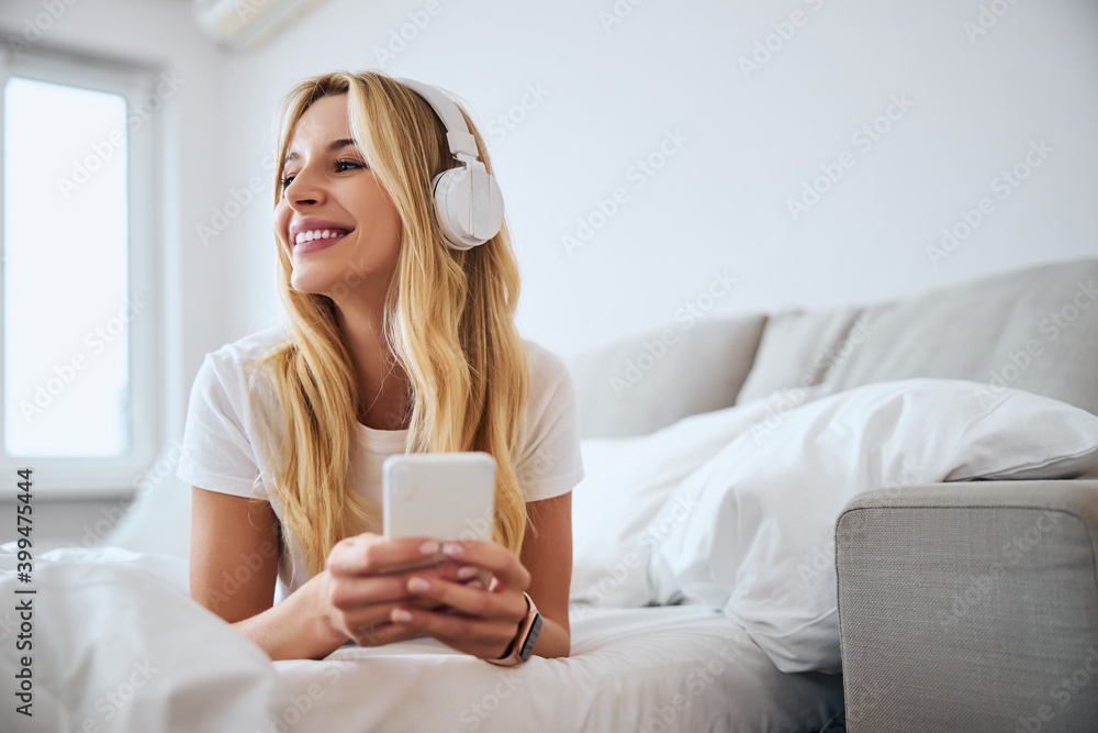 Positive delighted female being alone at home Positive delighted female being alone at home