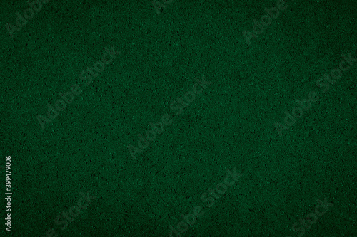 Abstract background - foamed rubber, non-uniform dark green backdrop for design.
