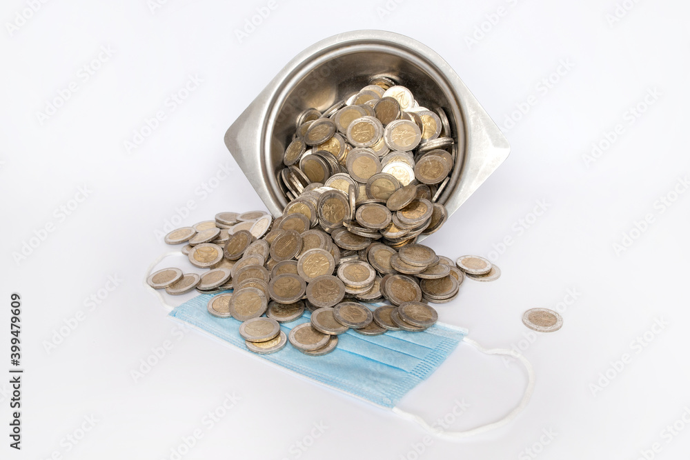 Dirty coins in a metal bowl. White background. Medical mask. Lithuanian money Dirty coins in a metal bowl. White background. Medical mask. Lithuanian money