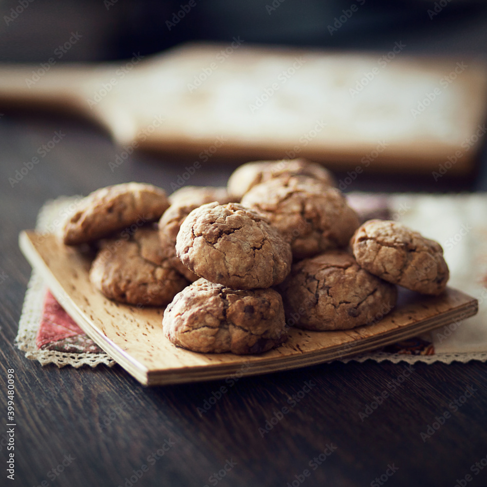 Handmade biscuits on the dark background. Oatmeal cookies Handmade biscuits on the dark background. Oatmeal cookies