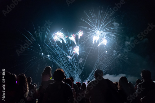Crowd watching fireworks and celebrating new year eve © NDABCREATIVITY