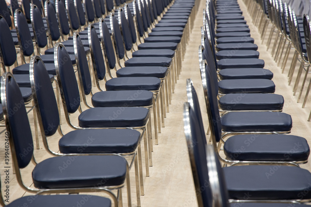 Empty chairs rows in the seminar hall. Place of meeting event or committee concept. Empty chairs rows in the seminar hall. Place of meeting event or committee concept.