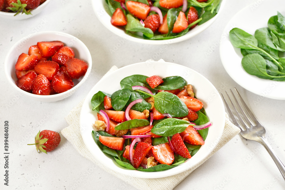 Healthy breakfast with fruit salad from strawberry, spinach and walnut Healthy breakfast with fruit salad from strawberry, spinach and walnut