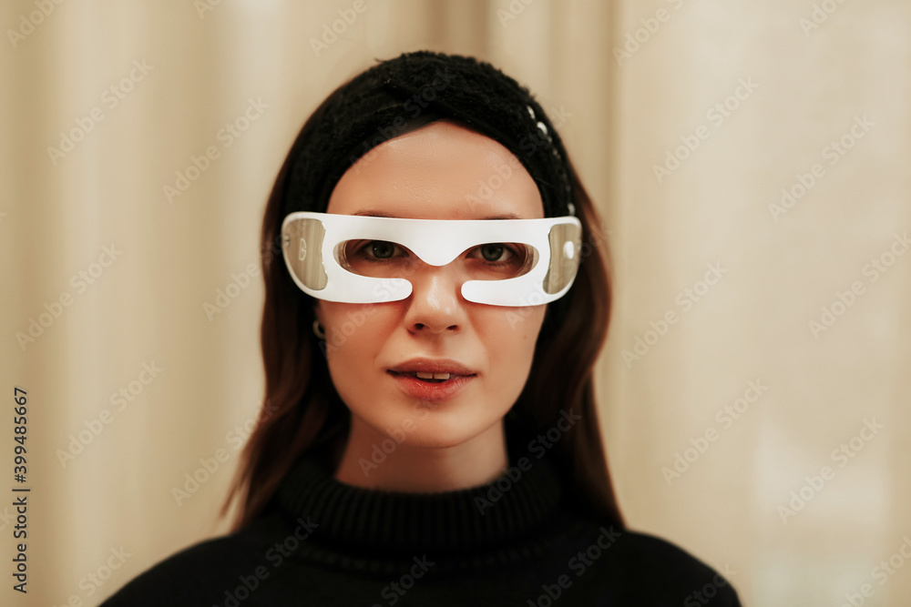 Portrait of a woman with LED glasses. Facial skin care. Portrait of a woman with LED glasses. Facial skin care.