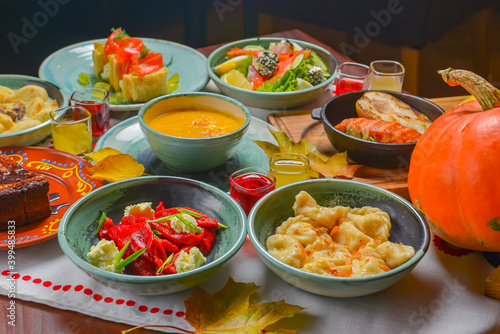 Traditional ukrainian food in assortment in festive decorating. Seasonal autumn menu served on table.