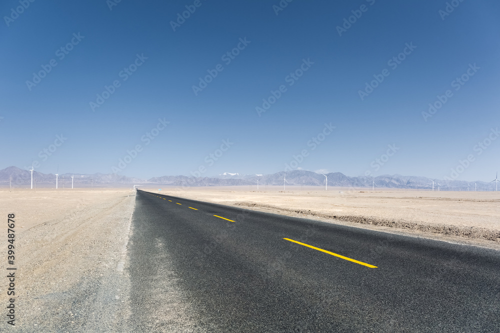 asphalt road through the wind farm asphalt road through the wind farm