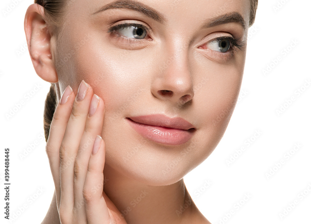 Beautiful woman face hands touching cheeks with healthy clean beauty skin close up Beautiful woman face hands touching cheeks with healthy clean beauty skin close up