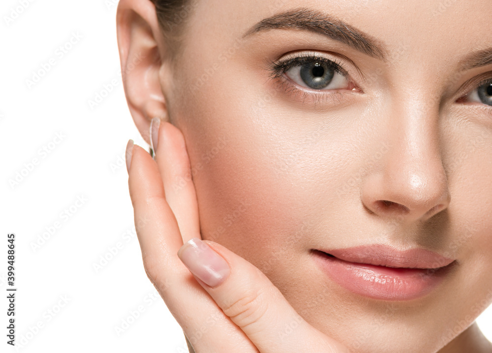 Beautiful woman face hands touching cheeks with healthy clean beauty skin close up Beautiful woman face hands touching cheeks with healthy clean beauty skin close up