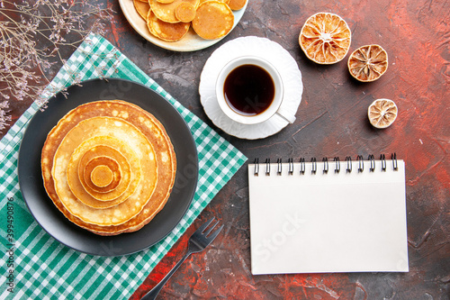 Pumpkin pie pancake mix a cup of tea and notebook photo
