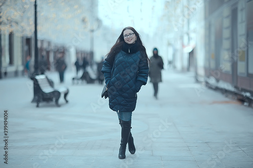 girl winter discounts shopping / young adult beautiful model in winter clothes in a urban setting