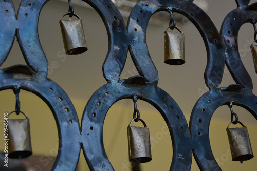 Horseshoe and cowbell, pidamidal decoration.