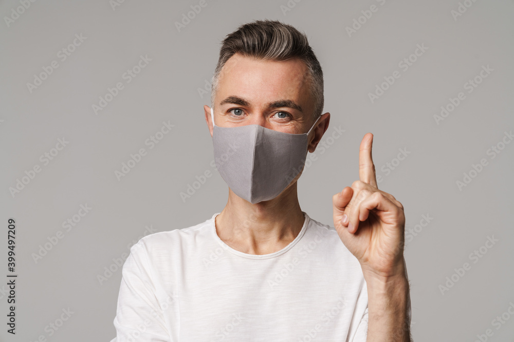 Close up of a comfident man pointing finger at copy space Close up of a comfident man pointing finger at copy space