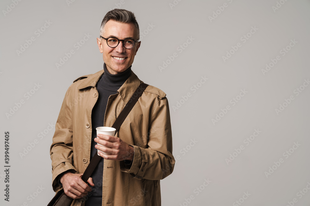 Handsome man wearing stylish coat posing isolated Handsome man wearing stylish coat posing isolated