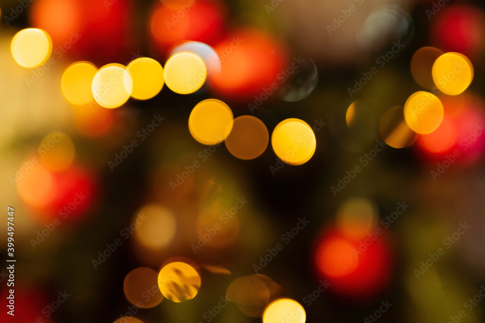 new year lights glow brightly with the rays from the garland. background texture of Christmas lights on a holiday tree. new year lights glow brightly with the rays from the garland. background texture of Christmas lights on a holiday tree.