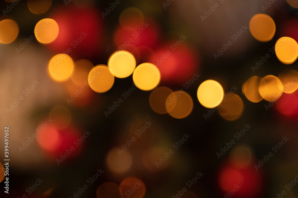 new year lights glow brightly with the rays from the garland. background texture of Christmas lights on a holiday tree. new year lights glow brightly with the rays from the garland. background texture of Christmas lights on a holiday tree.