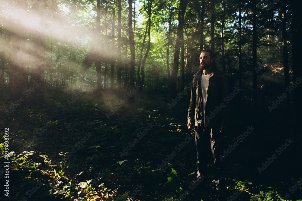 Obraz premium A man in nature. Seeker of adventures