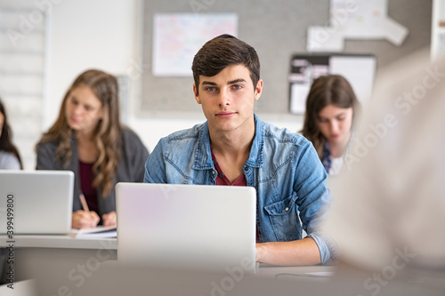 High school guy using laptop in classroom © Rido