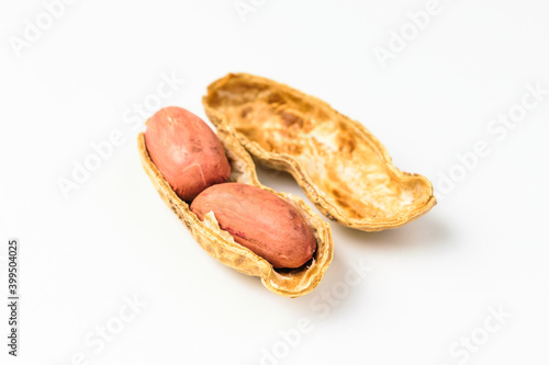 Raw peanuts on a white background