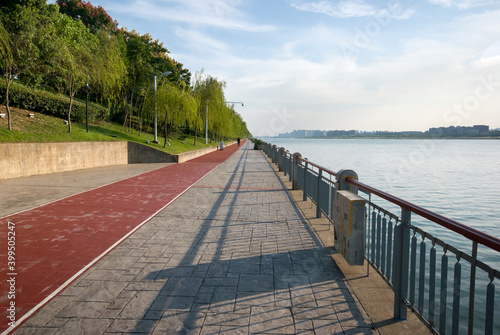 path in the park with a lantern and a bench