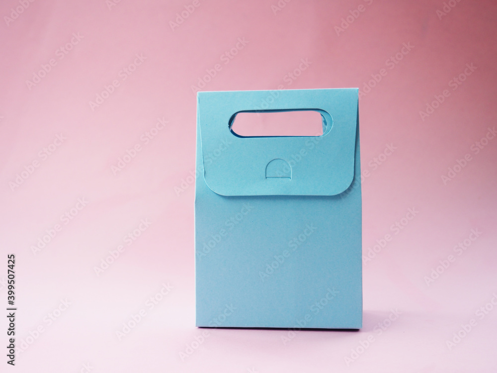 blue empty gift bag on pink background, for your design blue empty gift bag on pink background, for your design