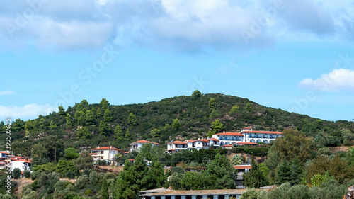 Buildings on a hill in Ouranoupolis, Greece photo