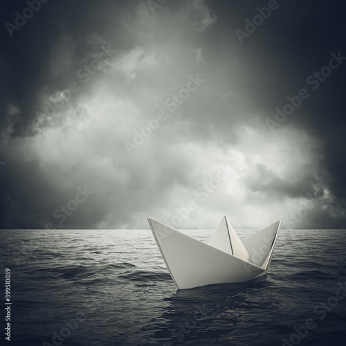 paper boat sails alone in a vast ocean.