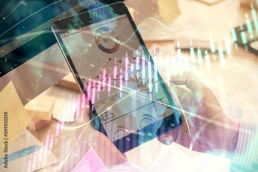 Double exposure of man's hands holding and using a phone and financial graph drawing. Analysis concept. Double exposure of man's hands holding and using a phone and financial graph drawing. Analysis concept.