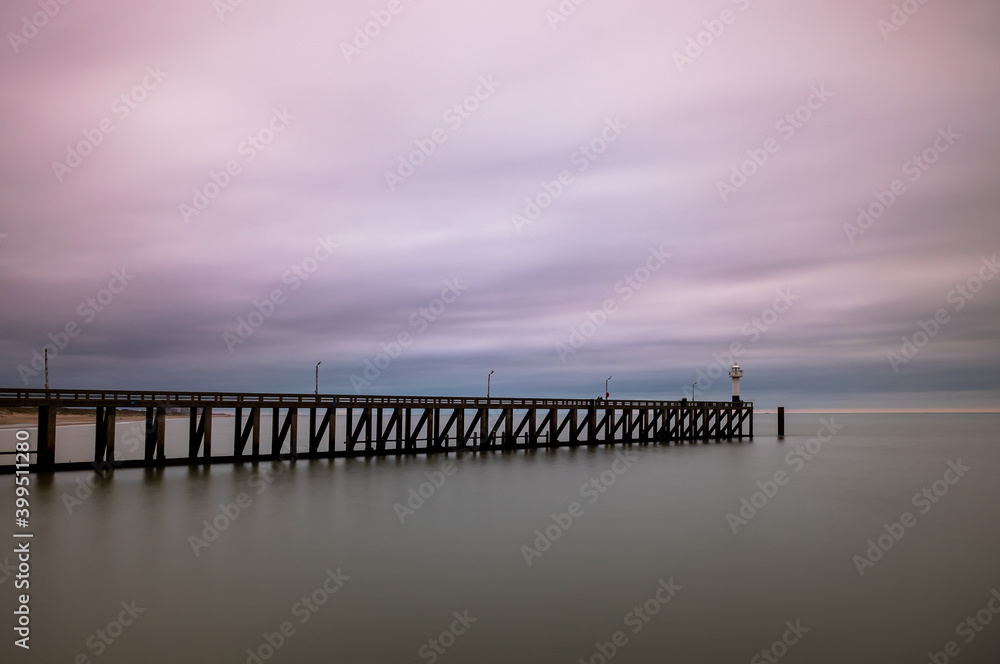 Long exposure image of the pier and lighthouse in Blankenberge, Belgium.