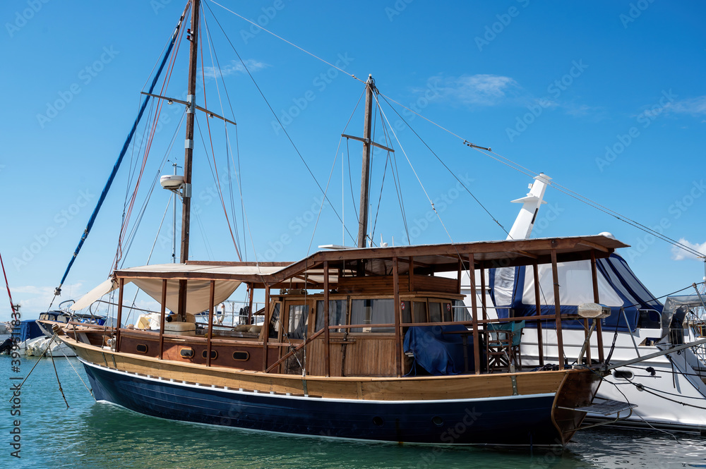 Moored vintage sailboat in Nikiti, Greece