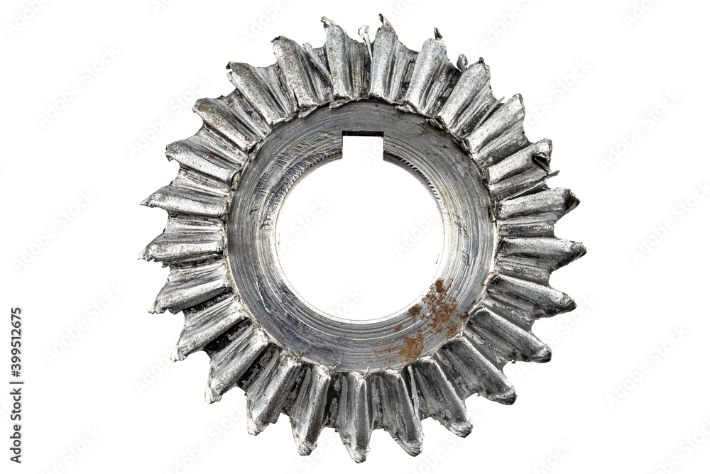 Macro shot of a damaged bevel gear with bevel teeth, isolated on a white background, top view. Macro shot of a damaged bevel gear with bevel teeth, isolated on a white background, top view.