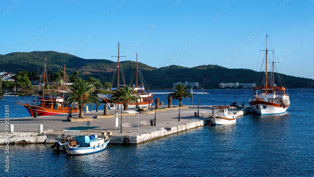 Pier and moored sailboats in Neos Marmaras, Greece