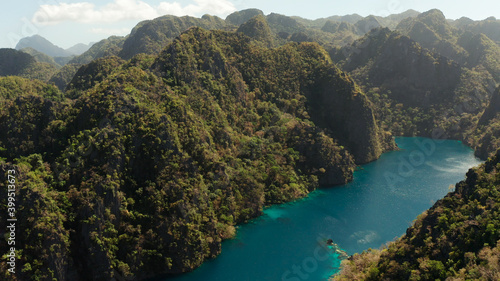 Aerial drone Kayangan lake with blue water on tropical island Coron. Lake in the mountains covered with tropical forest. Palawan, Philippines