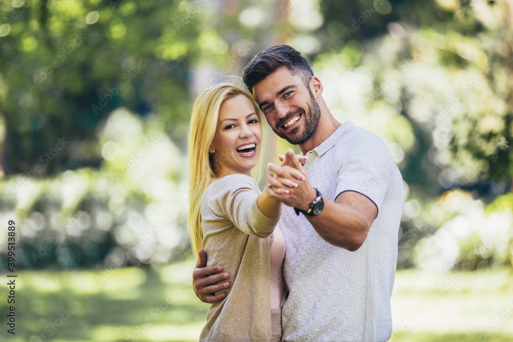 Fototapeta premium Happy couple in love walking in park