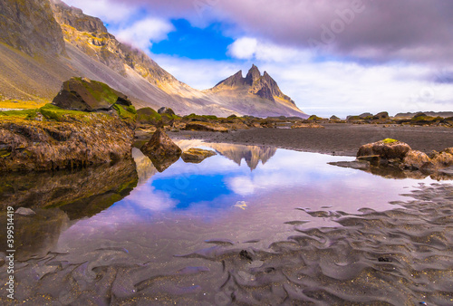  Incredible summer day on Stokksnes headland. Beautiful reflection of Vestrahorn (Batman) mountaine in the water during low tide. Southeastern Iceland, Europe. Visit Iceland. Beauty world.