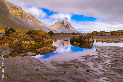  Incredible summer day on Stokksnes headland. Beautiful  reflection of Vestrahorn  Batman  mountaine in the water during low tide. Southeastern Iceland  Europe. Visit Iceland. Beauty world.