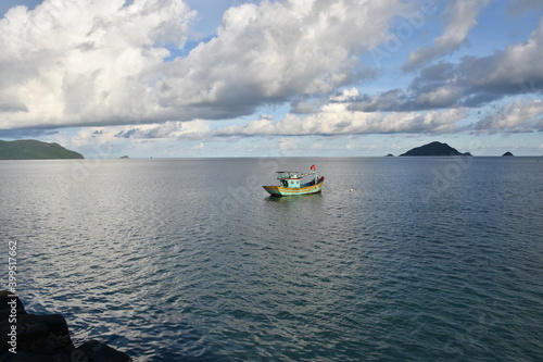 Fototapeta Naklejka Na Ścianę i Meble -  Vietnamese Fishing Vessel off the Coast of Con Dao, Extra Wide Shot