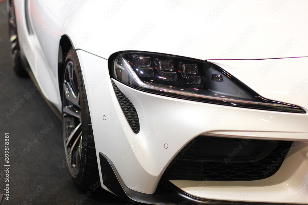 Detailing the headlights of modern luxury sports cars