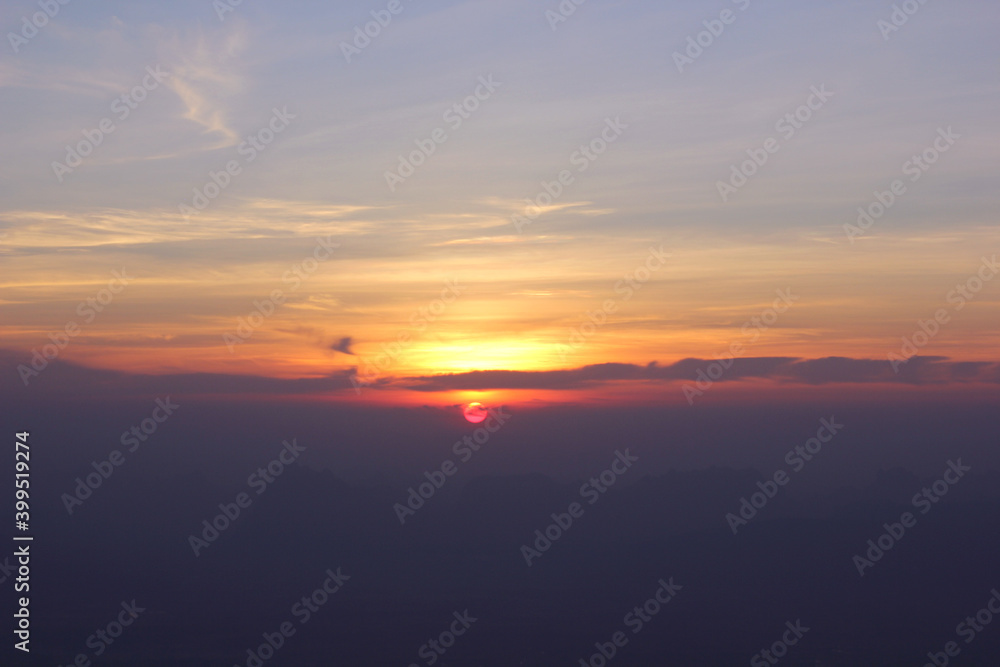 beautiful orange colour with clouds sunset view in the montain