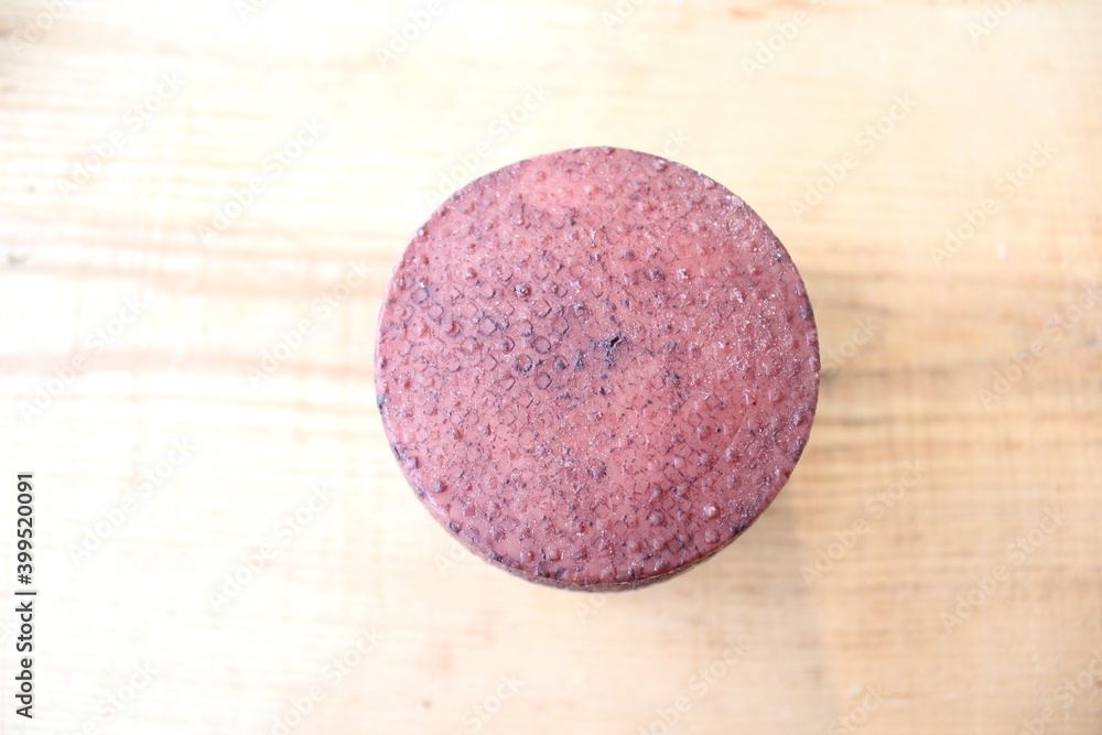 Farmer's cheese crust of cheese with grains inside. the texture as it Matures is handmade. pieces of cheese on a cutting Board in different colors of Derby, caciotta, cheddar Farmer's cheese crust of cheese with grains inside. the texture as it Matures is handmade. pieces of cheese on a cutting Board in different colors of Derby, caciotta, cheddar