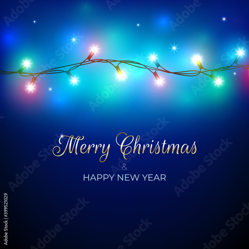 Merry Christmas and happy new year holiday greeting card. Colourful christmas lights. Glowing xmas garland. Glowing lights on blue background. Vector holiday xmas party banner design. Gold lettering