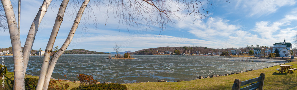 Late afternoon view of Lake Winnipesaukee and Meredith, New Hampshire, on a clear, crisp blue sky day.