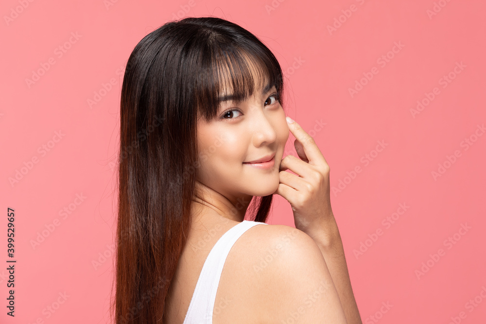 Young Beautiful Asian woman smile touching soft cheek with clean and fresh skin Happiness and cheerful with positive emotional,isolated on pink background,Beauty Cosmetics and spa Treatment Concept Young Beautiful Asian woman smile touching soft cheek with clean and fresh skin Happiness and cheerful with positive emotional,isolated on pink background,Beauty Cosmetics and spa Treatment Concept