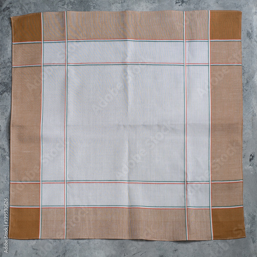 Leinwand Poster White brown handkerchief for men on grey background.