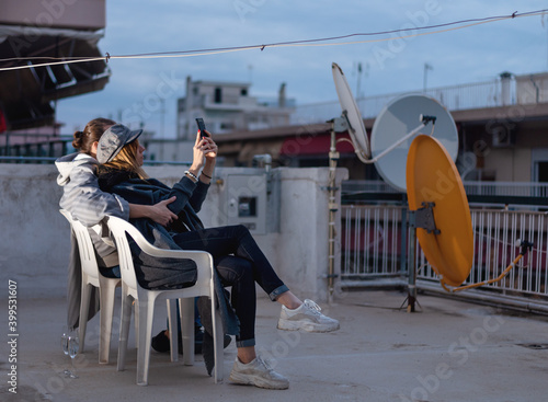 Young couple celebrating new years eve or st valentine's day on rooftop